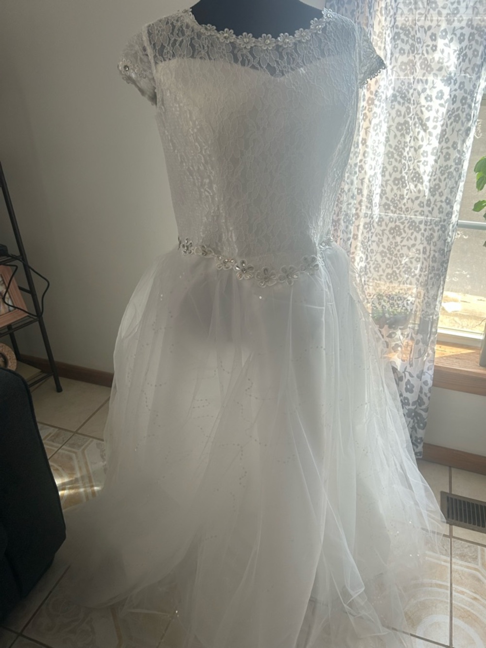 Wedding or prom dress. New with tags, is missing some decorations on the flower